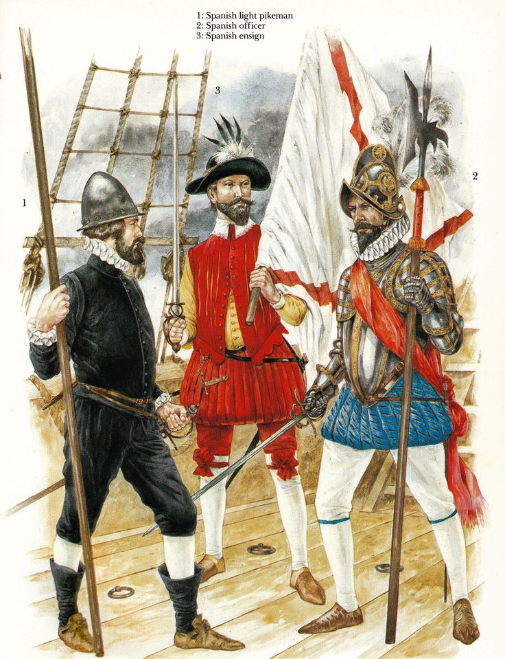 two men dressed in red and blue standing next to each other on a wooden deck