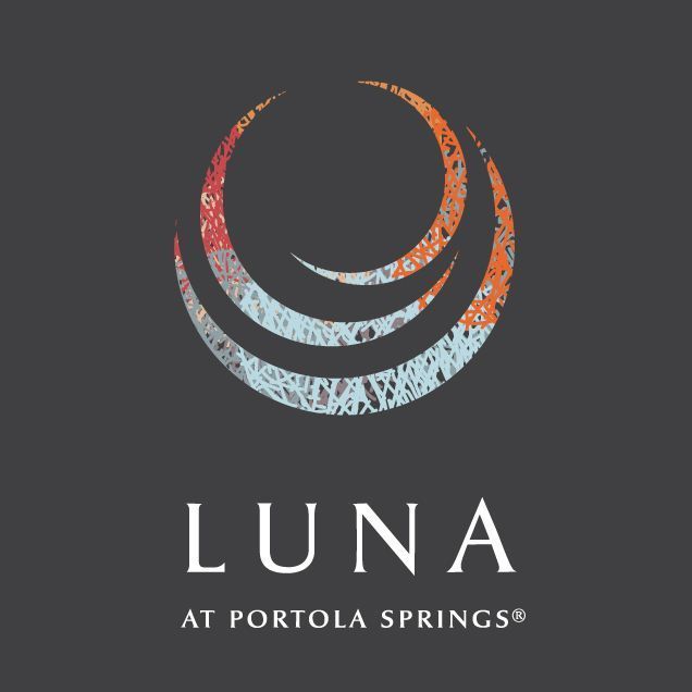 the lunaa at portillo springs logo on a black and gray background with an orange, red, and blue circle