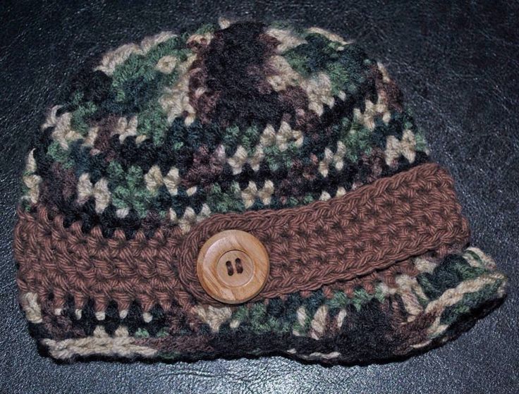 a knitted hat with a button on it