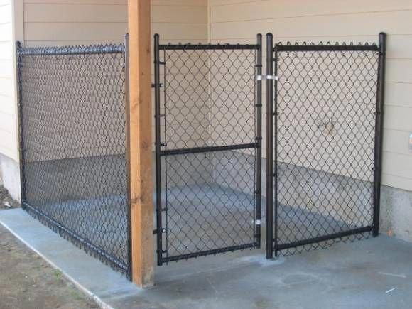 two gates are open on the side of a building with concrete flooring and walls