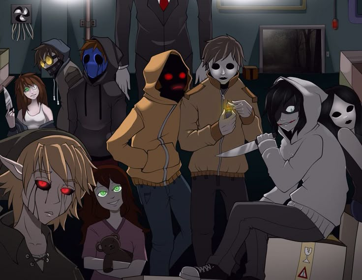 several people standing in a room with one person holding a cell phone and the other wearing a hoodie