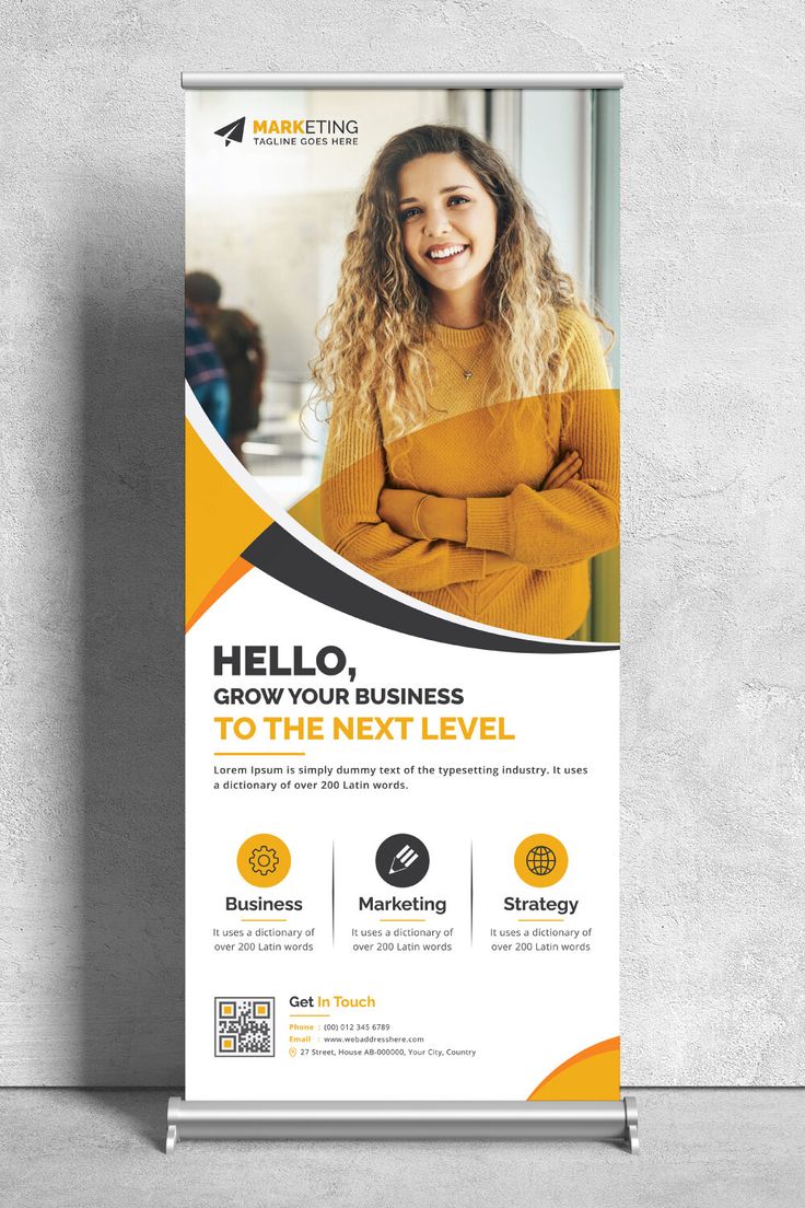 a roll up banner with an image of a woman smiling and looking at the camera