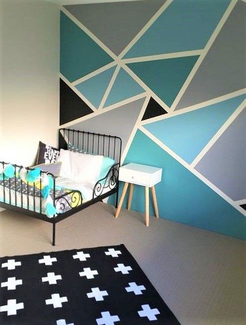 a baby's room with blue and white wallpaper, a crib and rug