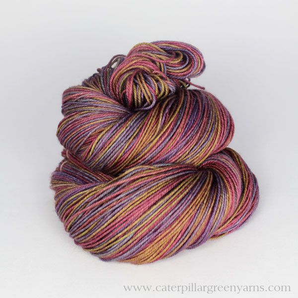 a multicolored skein of yarn on a white background