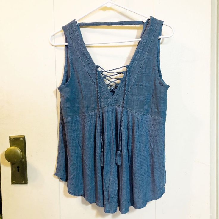 Lucky Brand Sleeveless Xs Blue Top Blouse Nwt Retails $59.50 Lace Up V-Neck Front. Low Back. Embroidered Neckline. Blue Gauze Material. 10" Deep V-Neck. 14" Across Back Sleeve Hem To Sleeve Hem. 11" Deep V- Opening On Back. 18" From Underarm Seam To Underarm Seam. 26" Long From Shoulder Seam To Bottom Of Top. 9" Strap Across Back To Keep Shoulder Straps Up. Knit (Lower Part Of Top) 95% Vicose 5% Linen Machine Wash Cold Water. Top Part Of Top: 100% Cotton Tassel 100% Polyester From A Smoke Free B Summer Rayon V-neck Tops, V-neck Tank Top For Spring Day Out, Summer V-neck Rayon Tops, Summer V-neck Vest Top, Blue V-neck Vest Top, Casual V-neck Vest Blouse, Blue Cami Summer Blouse, Blue Cami Blouse For Summer, Rayon V-neck Tank Top For Day Out