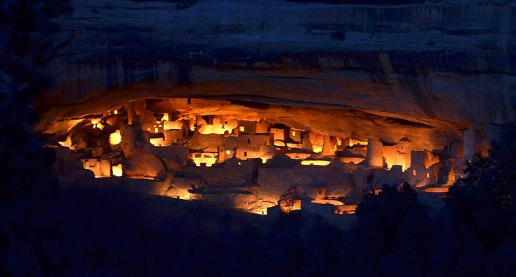 an aerial view of a village lit up at night