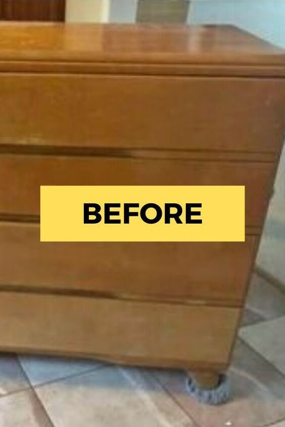 a brown dresser sitting on top of a tiled floor