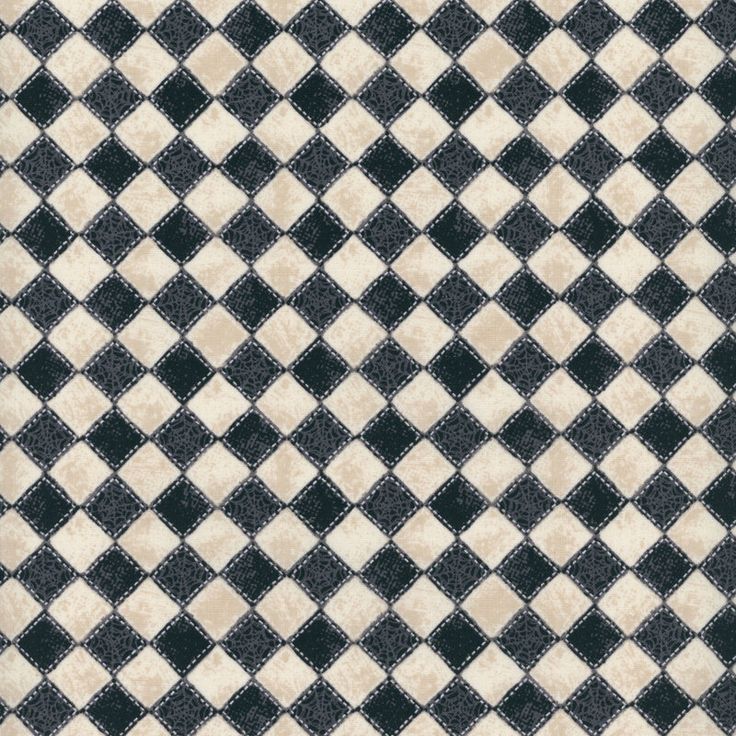 a black and white checkered rug with squares on it