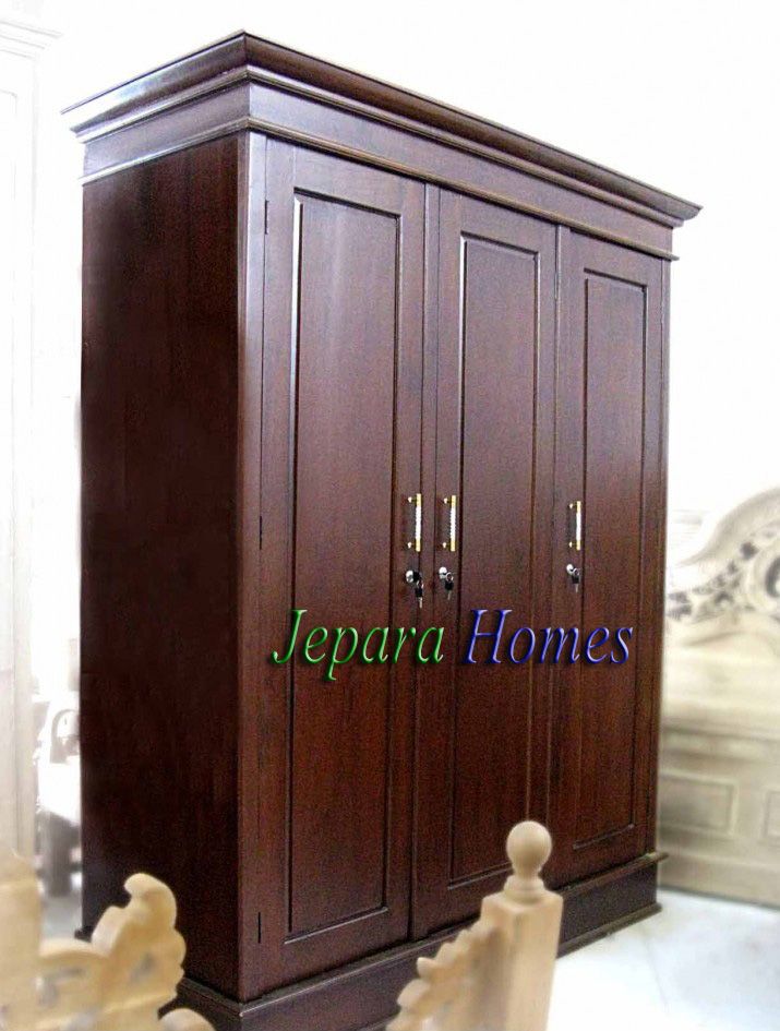 a large wooden cabinet sitting in the middle of a room