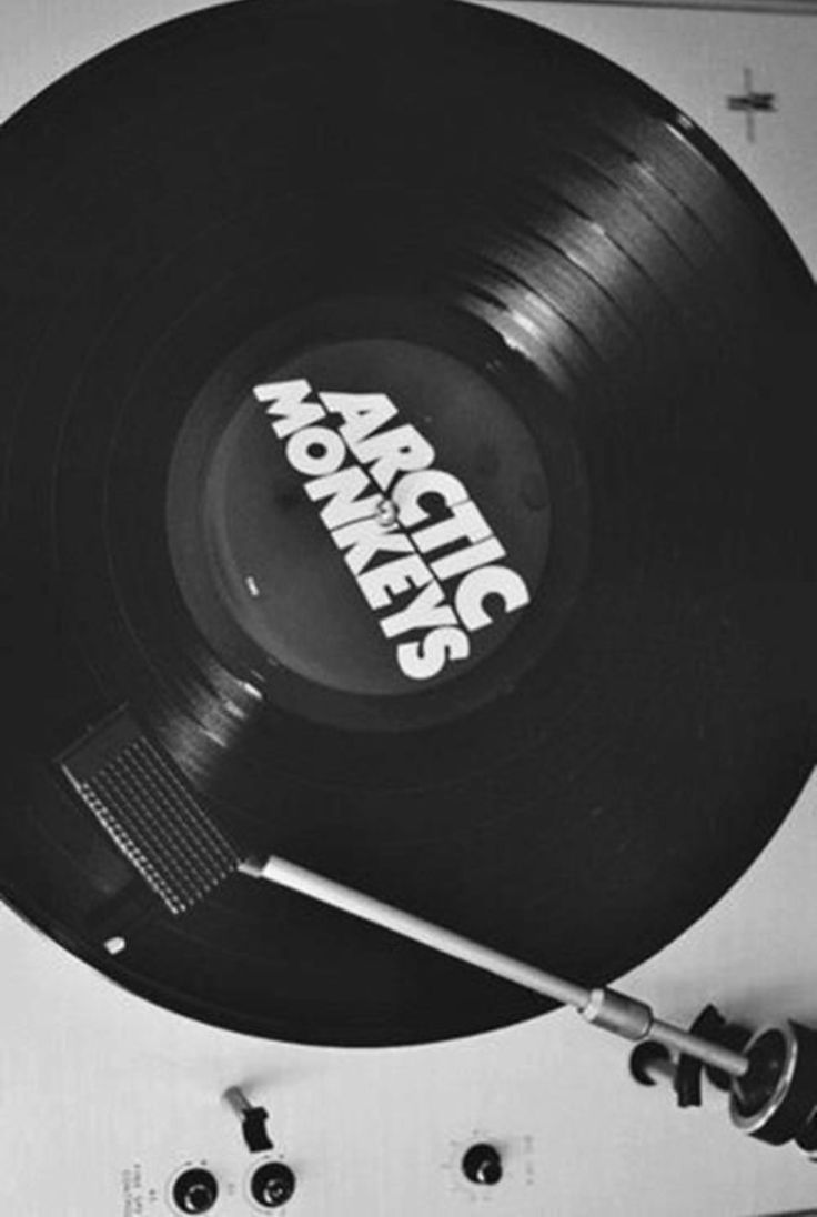 an old record player with the word rock and roll on it's side, in black and white