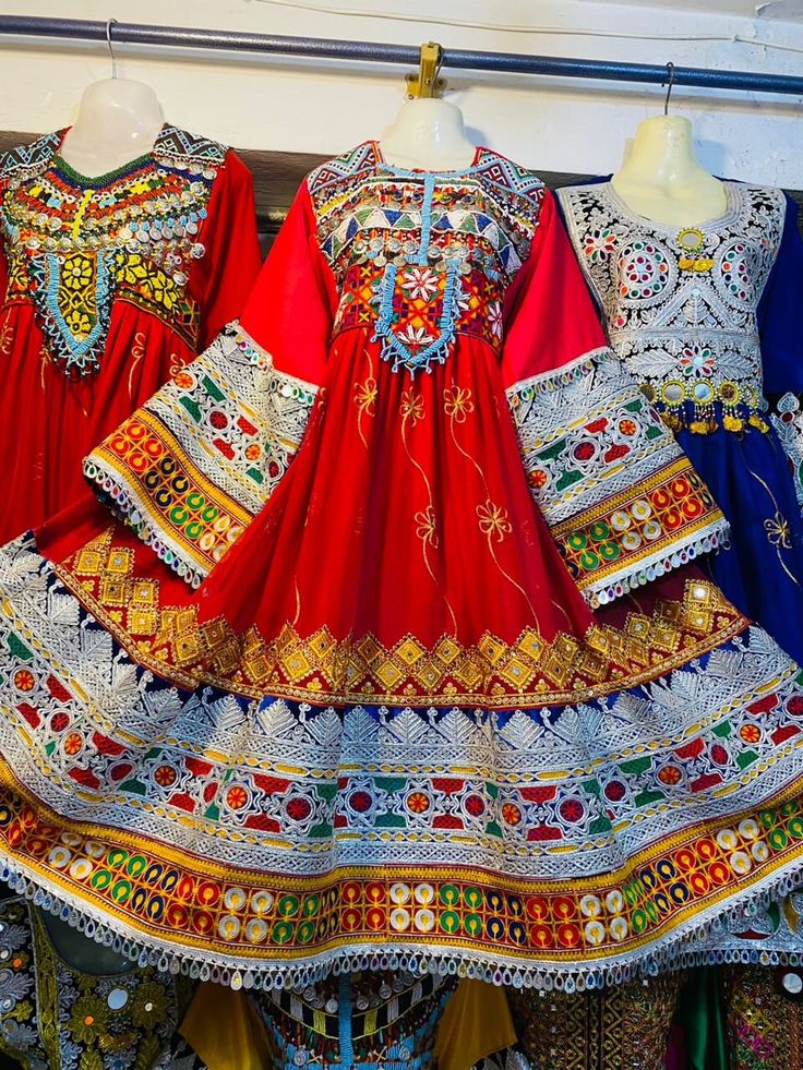 Crafted in a rich colorful fabric, this dress features intricate embroidery, vibrant colors, and decorative patterns that celebrate the beauty of folk craftsmanship. Perfect for festive occasions and cultural events, this handcrafted attire exudes elegance and tradition, making it a standout piece in any wardrobe. Embrace the charm of ethnic wear with this exquisite, one-of-a-kind outfit Traditional Navratri Dresses With Motifs, Multicolor Embroidered Dress With Traditional Patterns For Festival, Traditional Pattern Dresses For Navratri Ceremonies, Bohemian Ceremonial Dress With Traditional Patterns, Traditional Ceremonial Dresses With Motifs, Traditional Dresses For Navratri With Traditional Patterns, Ceremonial Dresses With Traditional Patterns For Navratri, Traditional Ceremonial Dress With Embroidered Motifs, Traditional Festive Dress With Embroidered Border