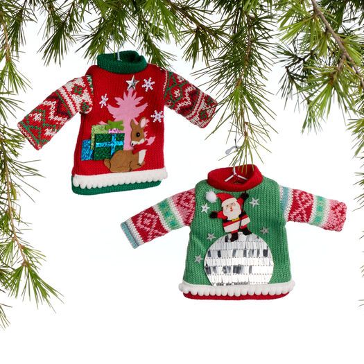 two christmas sweater ornaments hanging from a tree