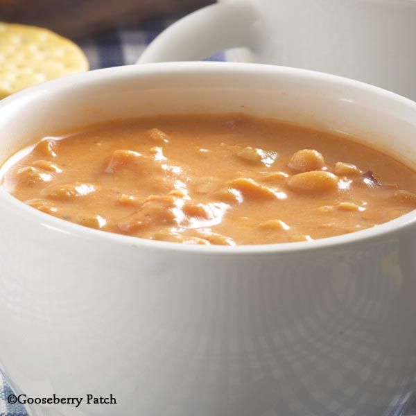 a white bowl filled with soup on top of a table