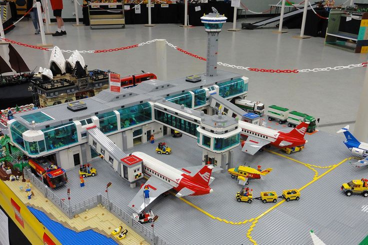 a lego model of an airport with cars and planes