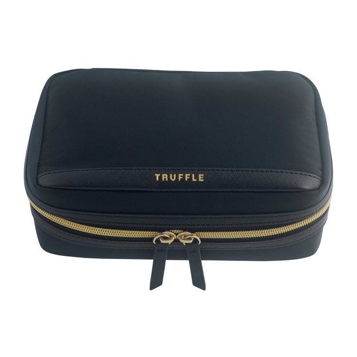 the truffle travel case is black and has gold trimmings on it