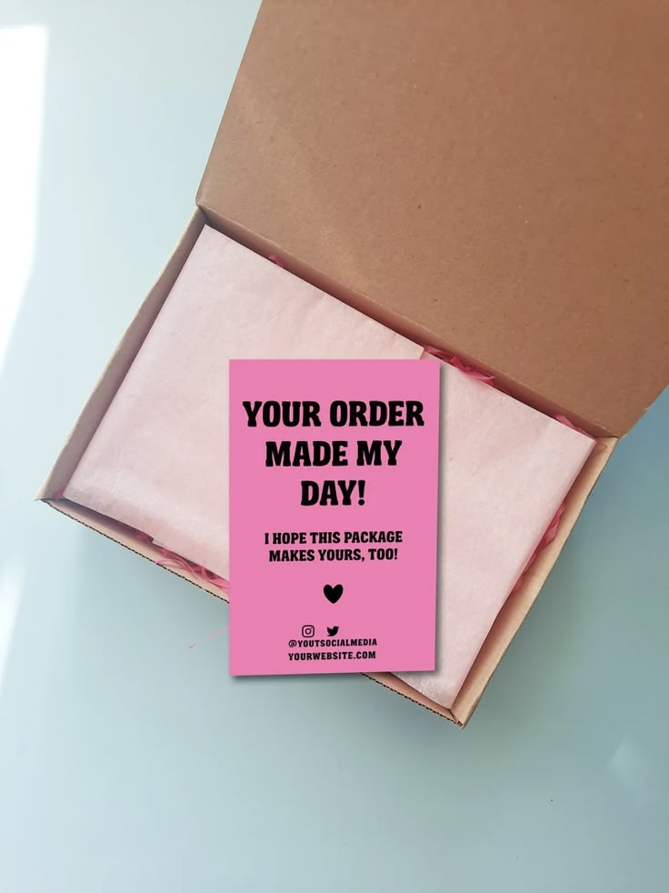 an open cardboard box with a pink card in it that says your order made my day