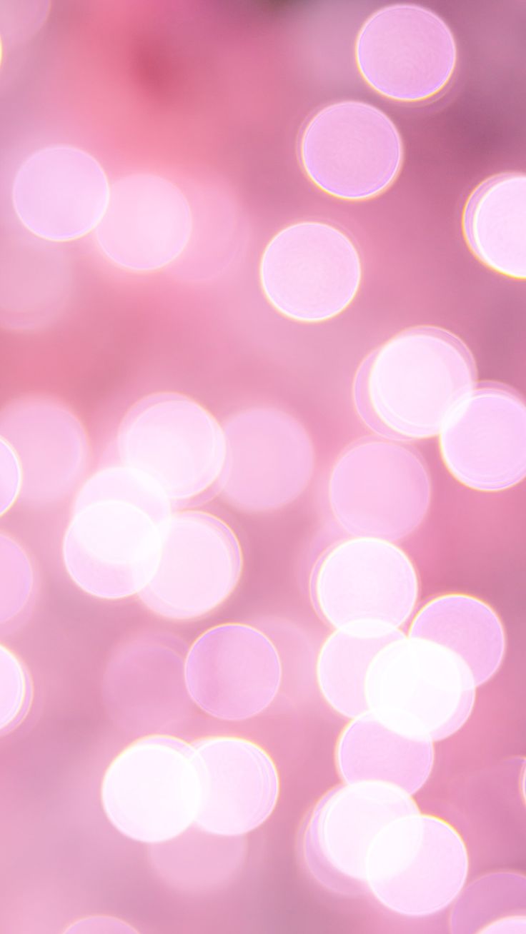 blurry image of pink and white lights