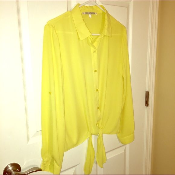 Neon yellow sheer blouse. Collective concepts originally purchased from Lord & Taylor. Neon yellow. Button down. Sheer blouse. Tie front. Buttons to roll up sleeves. 100% polyester. Medium. Never been worn - NWOT! Collective Concepts Tops Blouses Roll Up Sleeves, Sheer Blouse, Neon Yellow, Roll Up, Top Blouse, Long Sleeve Blouse, Blouses, Neon, Yellow