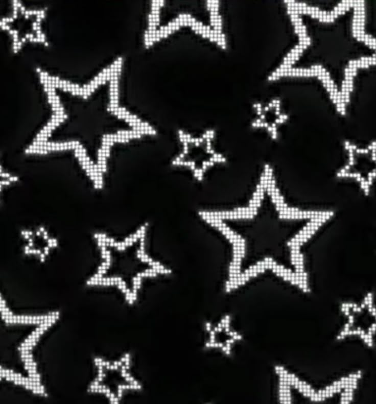 black and white stars are arranged in the shape of small dots on a dark background