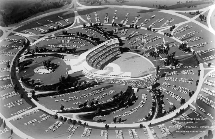 an aerial view of a stadium with many cars parked in it