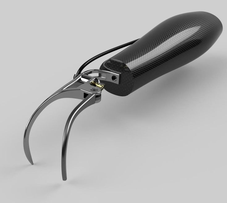 a pair of pliers with black handles on a gray background, cut open by scissors