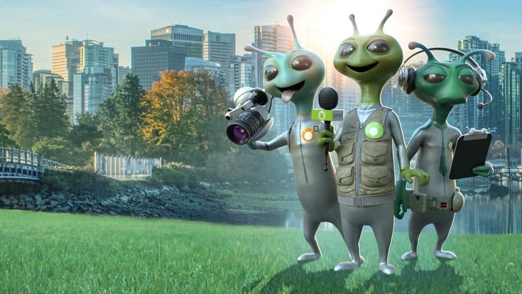 three aliens are standing in the grass with their arms around each other