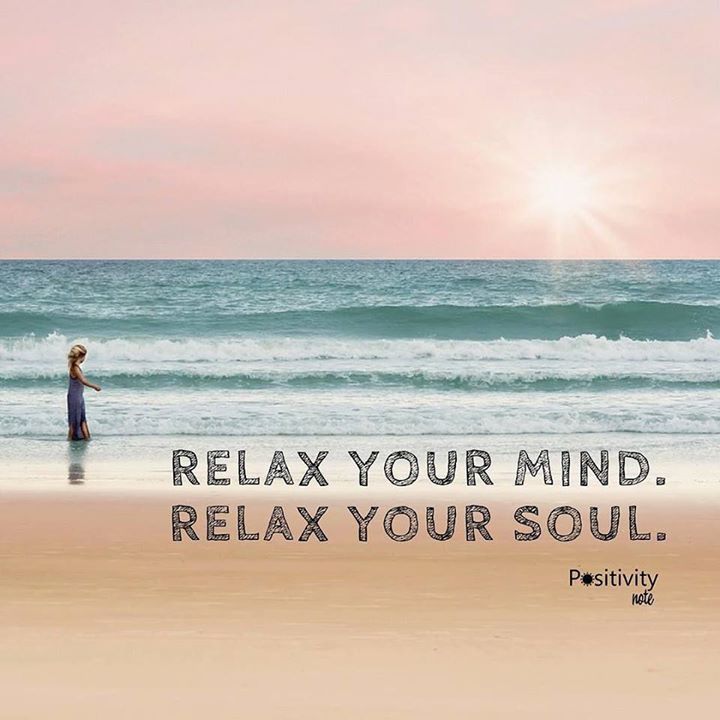 a woman standing on top of a beach next to the ocean with a quote about relax your mind