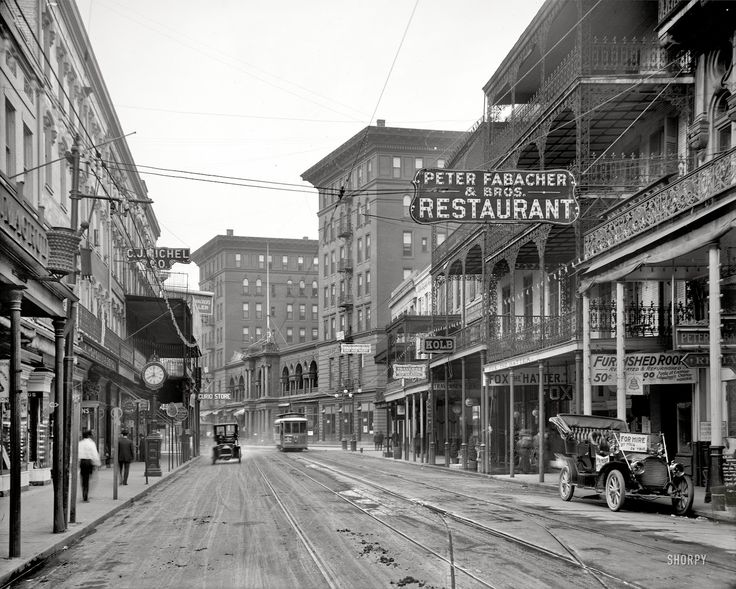 an old black and white photo of a city street