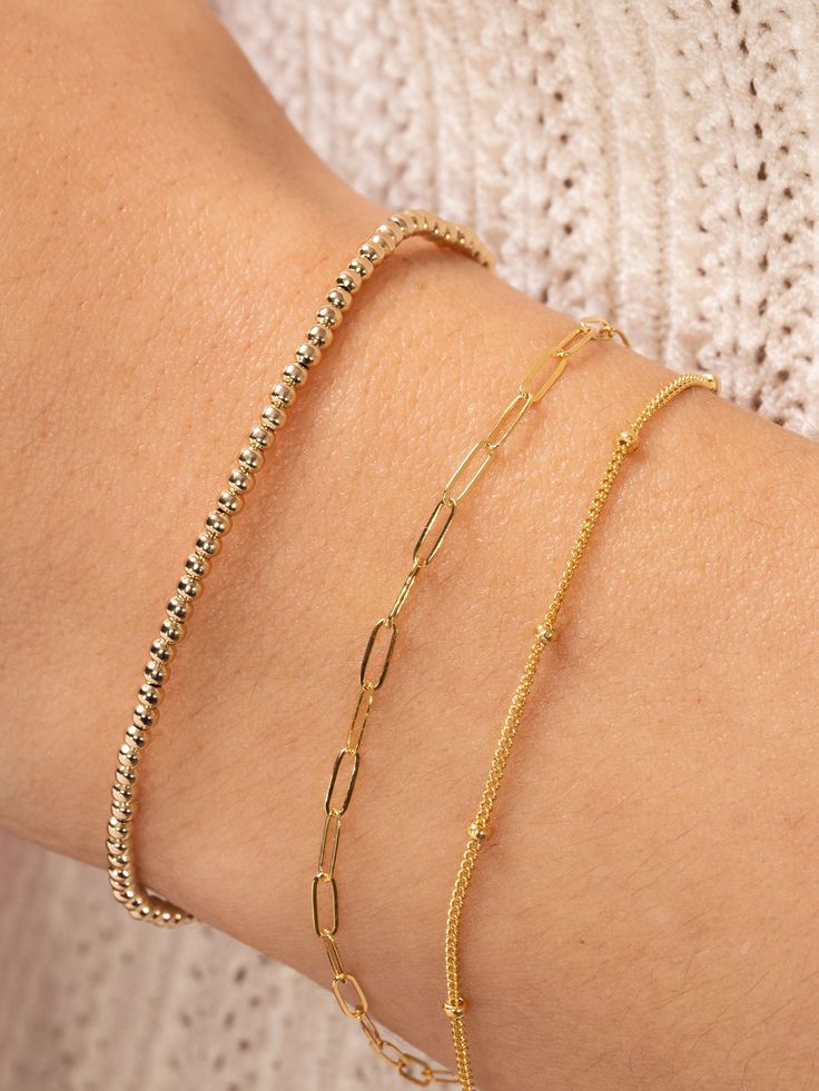 The perfect layering bracelet is dainty and simple — like our Satellite Layering Bracelet! The classic chain goes with any style, and the delicate size fits in with any stack. If your wrist is in need of another layering piece, you've just found it. Pyrite Bracelet, Everyday Bracelet, Rosary Chain, Initial Jewelry, Dainty Bracelets, Layered Bracelets, Paper Clip, Beaded Chain, Mix And Match