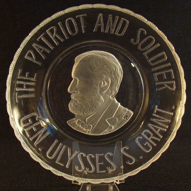 a glass plate with an image of a man's face and words on it