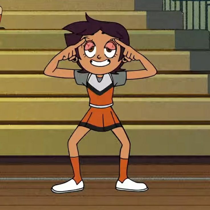 an animated girl is holding her head while standing in front of the bleachers