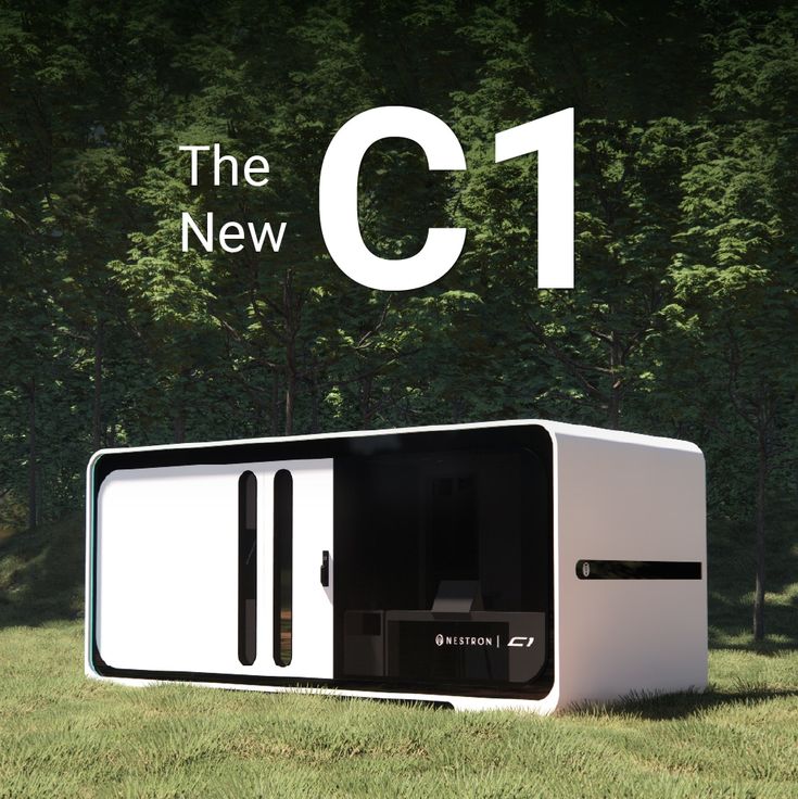 an advertisement for the new c - 1 computer is shown in front of some trees