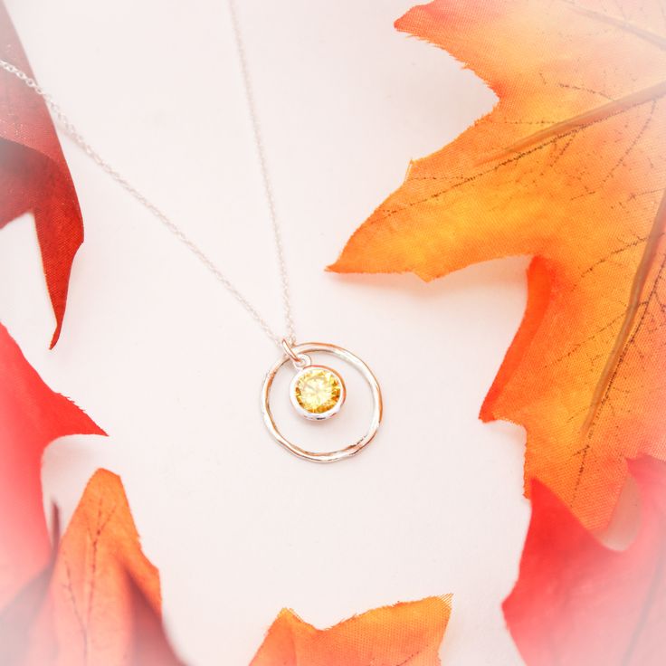 November Birthstone Necklace, November Yellow Topaz Jewelry, November Birthday Gift, November Birthstone Jewelry, Sterling Silver Necklace Lovely November Birthstone Yellow Topaz Necklace. People born in November have two birthstones - Topaz & Citrine. For many designs we use the topaz birthstone, a beautiful amber-colored gem. It symbolizes love and is said to bring strength and increased intellect to the wearer. 💛 A rustic, sterling silver twig ring (20mm in diameter), surrounds a beautif Amber Gemstone Necklace For Anniversary, Silver Topaz Birthstone Necklaces, Yellow Jewelry With Bezel Setting For Gift, Silver Topaz Necklaces With Birthstone, Topaz Birthstone Jewelry With Round Stone, Yellow Bezel Setting Jewelry Gift, Gift Yellow Bezel Setting Jewelry, Citrine Birthstone Necklace For Anniversary, Citrine Birthstone Jewelry With Round Stone