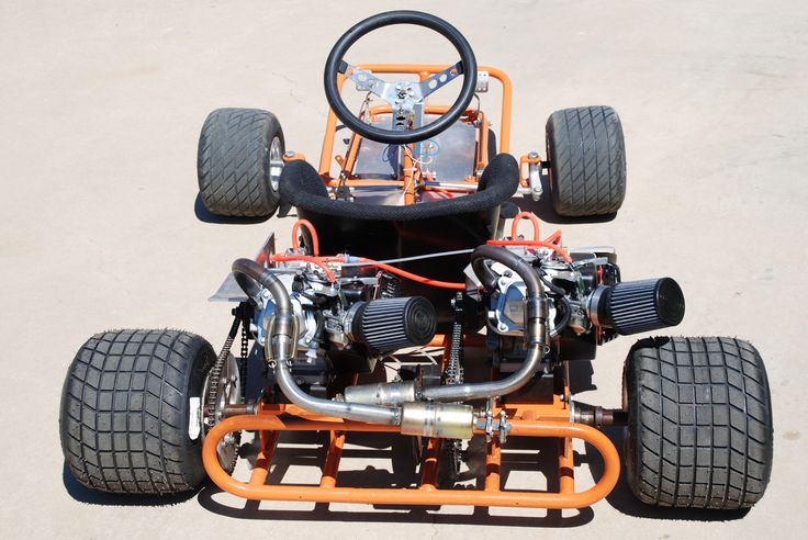 an orange and black vehicle with four wheels