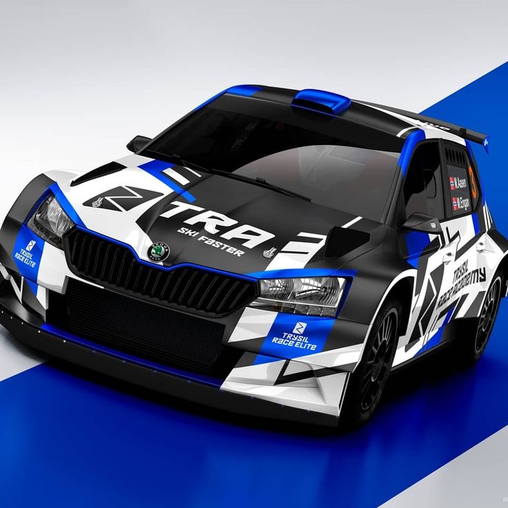 an image of a car that looks like it is racing on the track with blue and white stripes