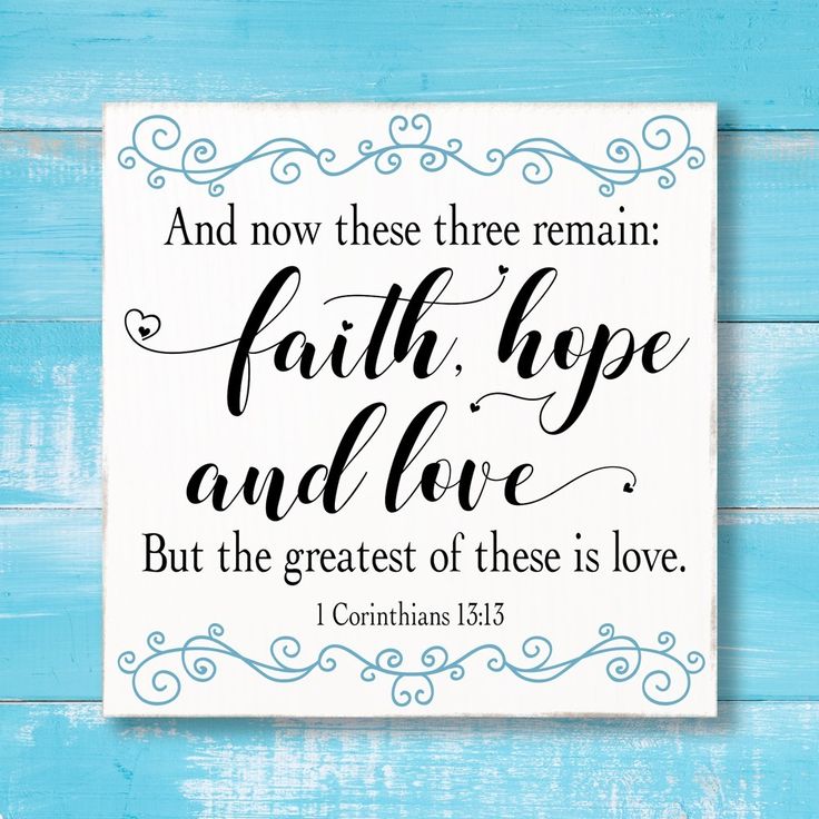 a wooden sign that says, and now these three remain faith hope and love but the greatest