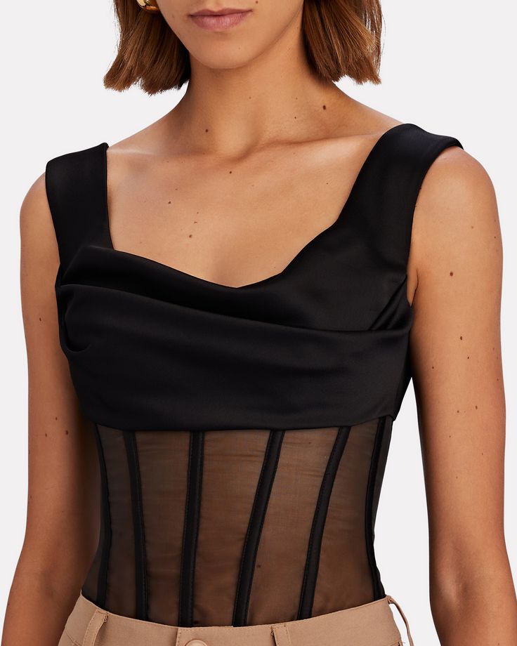 There's always much to love about ROZIE CORSETS' figure-flattering corsetry and the same rings true for its satin top which drapes at the bust and hugs at an organza bodice. Wear yours with flowy wide-leg pleats to offset the tapered fit.   Fabric: 97% polyester, 3% elastane.   Lining: 98% polyester, 2% elastane.   Back zip closure.   Dry clean.   Imported.       Length from shoulder to hem: 18".   Model is wearing size FR 34.  Model height 5'11", bust 32", waist 24", hips 34".      Item is list Evening Ruched Corset With Sweetheart Neckline, Party Corset With Lined Bodice And Organza Material, Party Corset With Lined Bodice In Organza, Organza Corset With Lined Bodice For Parties, Strapless Organza Corset For Evening, Evening Organza Corset With Boned Bodice, Organza Corset With Fitted Bodice For Evening, Elegant Sleeveless Ruched Corset, Party Organza Bodice With Corset Back