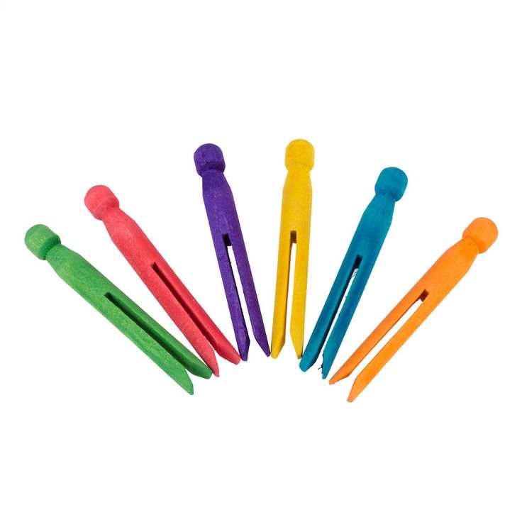 six different colored plastic toothbrushes arranged in a circle