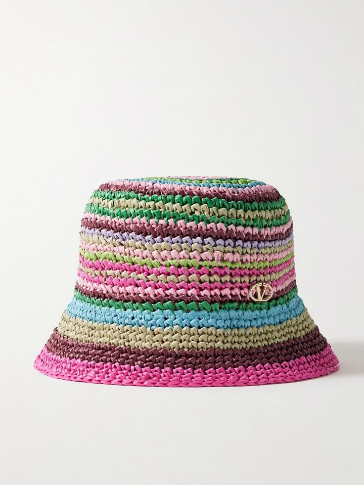 a multicolored straw hat on a white background