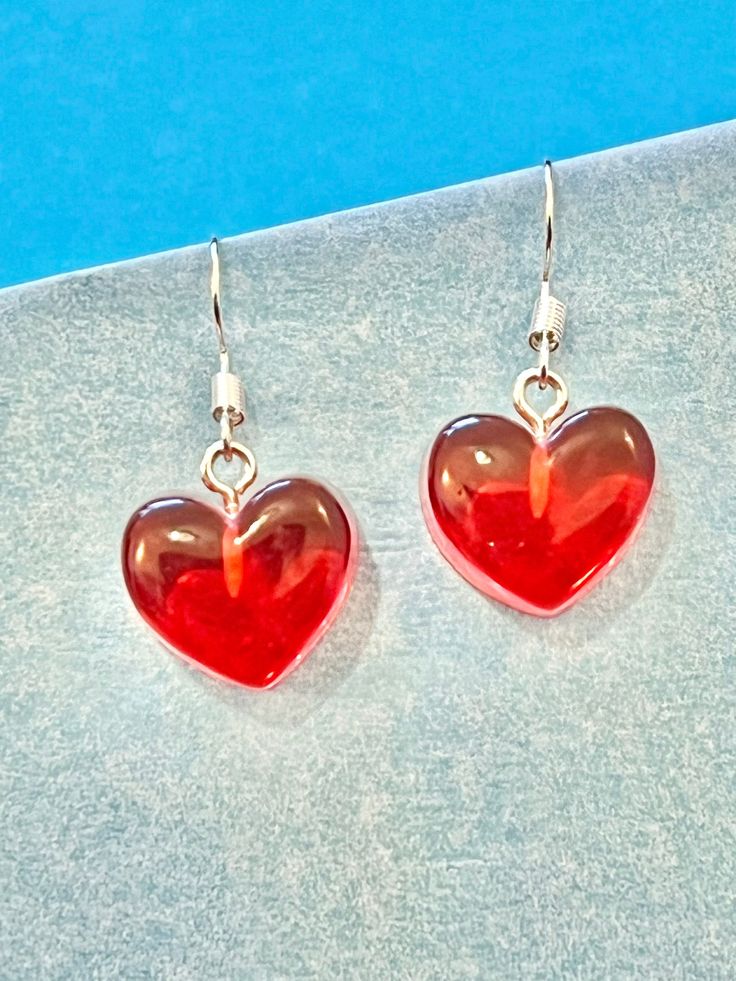 Beautiful Heart red dangle earrings.   These are light weight and look gorgeous.  You can choose from hook or hoop.  The Hoop measures 3cm in width Enjoy... The hook and hoop is made of plated sterling silver to protect your ears and the heart is made of resin. They come well presented and wonderful for a birthday present for a friend, family or your loved one, or maybe a present for yourself. Thank you for taking the time to look at my earrings and please visit my shop for more original designs. Sharlene x For Fun, Funky, Quirky and original designs, please visit my shop.   https://www.etsy.com/uk/shop/bespokedanglers Earrings to suit all xx Sharlene xx Trendy Earrings For Valentine's Day Gift, Trendy Valentine's Day Earrings For Gift, Trendy Valentine's Day Gift Earrings, Sweet Drop Earrings As A Gift, Sweet Drop Earrings For Gift, Playful Earrings For Valentine's Day Gift, Playful Earrings As Valentine's Day Gift, Trendy Heart-shaped Earrings For Gifts, Trendy Heart Drop Earrings As Gift