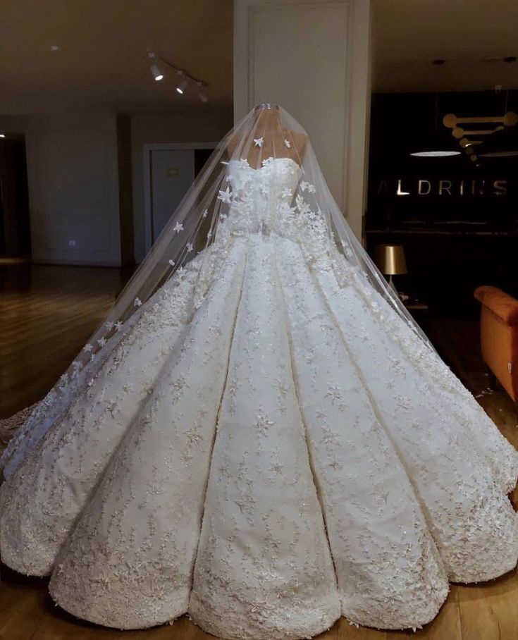 a wedding dress on display in a room