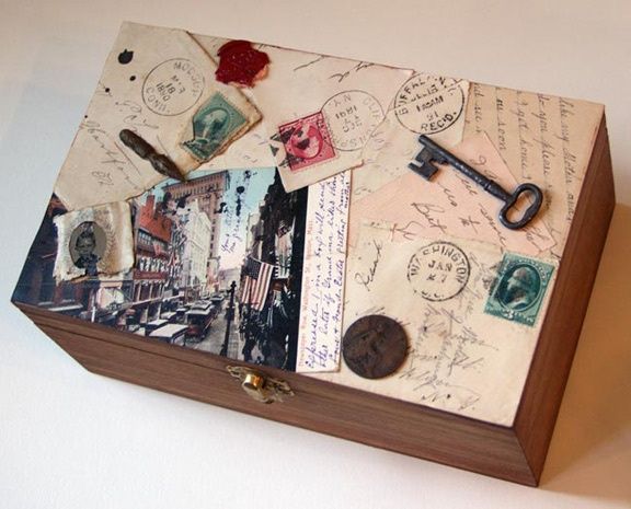 an open box with stamps and keys on it