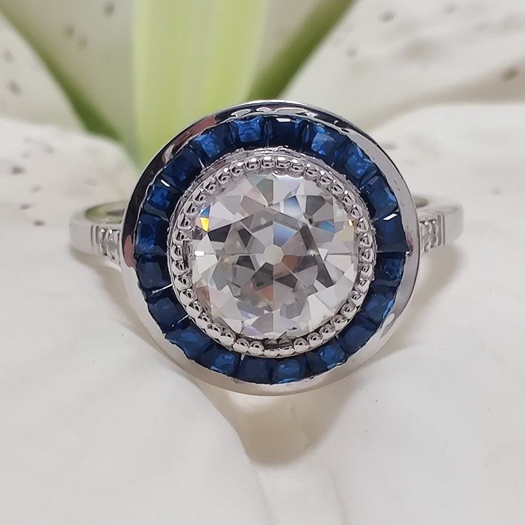 2.50 Ct Old European Cut Diamond Engagement Ring, Round Cut Diamond Ring, Halo Sapphire Accent, 925 Sterling Silver, Handmade Gift For Women "Exquisite 2.50 Ct Old European Cut Diamond Engagement Ring with Halo Sapphire Accent in 925 Sterling Silver - Handmade Elegance for Her." ✪ 𝐇𝐚𝐧𝐝𝐦𝐚𝐝𝐞, 𝐡𝐢𝐠𝐡-𝐪𝐮𝐚𝐥𝐢𝐭𝐲 𝐢𝐭𝐞𝐦 ✔ ✪ ITEMS SPECIFICATION ★ Brand Name                     : Veniciajewel ★ Center Stone Use            : Moissanite  ★ Main Stone Shape           : OEC Round Cut ★ Main Gia Certified 14k White Gold Cluster Ring, Art Deco Diamond White Halo Ring With Center Stone, Gia Certified Moissanite Cluster Ring, Gia Certified Moissanite Cluster Ring For Anniversary, Diamond White Sapphire Ring With Center Stone For Gift, Sterling Silver Halo Ring In Diamond White For Anniversary, Classic Moissanite Topaz Anniversary Ring, Sterling Silver Halo Ring With Diamond White Center Stone, White Sapphire Ring With Center Stone As Gift