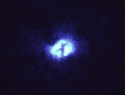 an image of a bright blue object in the dark night sky with no light on it