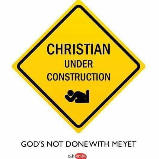 a yellow sign that says, christian under construction god's not done with me yet