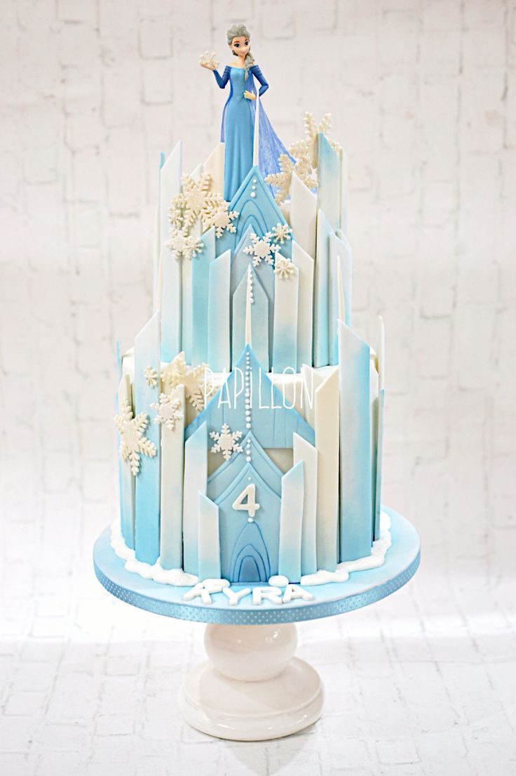 Frozen themed castle cake with Elsa toy figure | Frozen themed ...