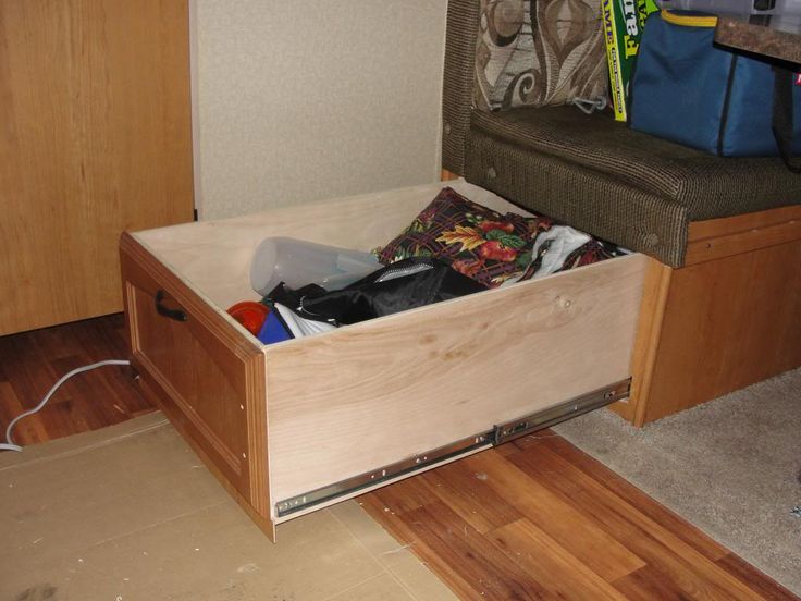 an open drawer in the middle of a room