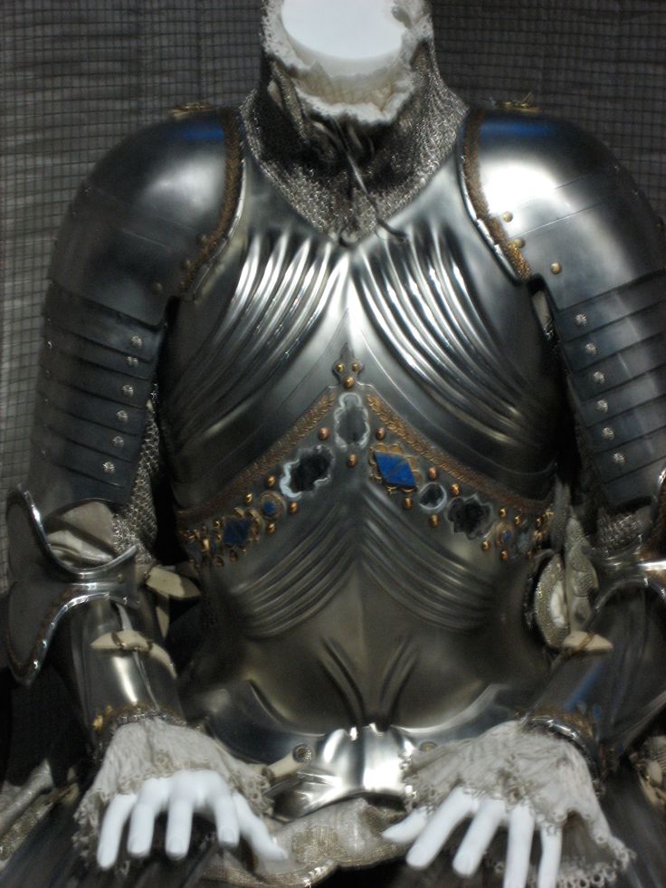 a metal armor sitting on top of a table