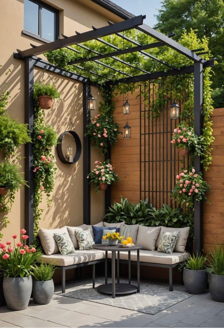 an outdoor seating area with potted plants and flowers