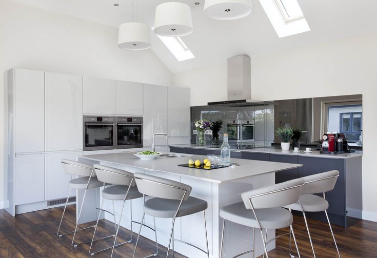 a kitchen with an island and four stools